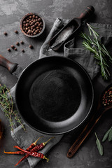 dark culinary background with empty black pan and space for text recipe or menu