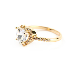 Golden ring with a gem stone isolated