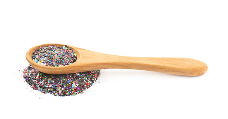 Wooden spoon full of sequins