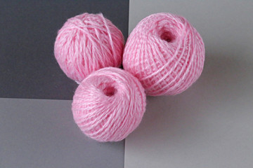 balls of wool on a gray geometric background