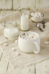 white cup with cocoa and marshmallows, selective focus
