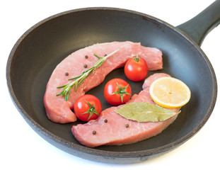 Raw pork on a pan isolated on white background.