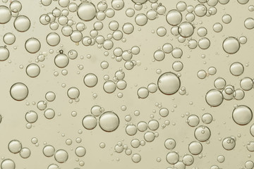 Flowing air bubbles soars over a golden background