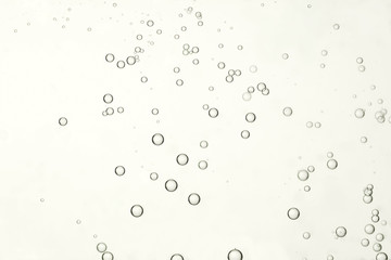 Naklejka na ściany i meble Beautiful air bubbles isolated over a beige background