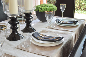 elegant table set in modern style dining room interior