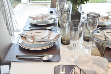 elegant table set in modern style dining room interior