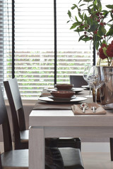 Modern classic dining set on wooden table with natural lighting