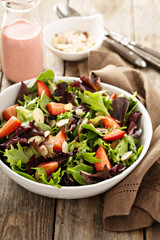 Healthy and colorful salad with spring mix greens