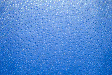 Water drops blue background. Water drops on glass background