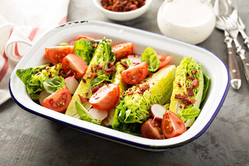 Wedge salad with baby lettuce and tomatoes