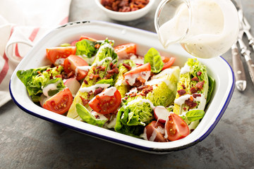 Wedge salad with baby lettuce and tomatoes