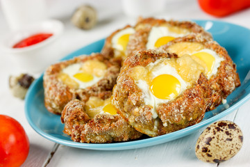 Meat nest with quail eggs and cheese