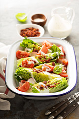 Wedge salad with baby lettuce and tomatoes