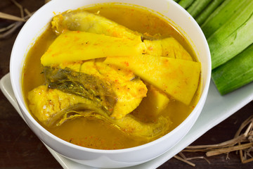 Yellow curry snapper fish with coconut shoots thai food
