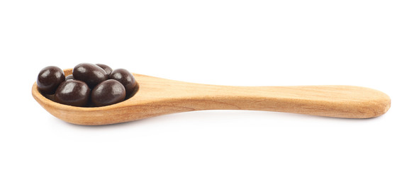 Wooden spoon full of candies