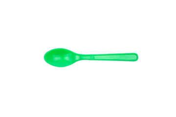 Green plastic spoon isolated on white background