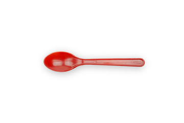 Red plastic spoon isolated on white background