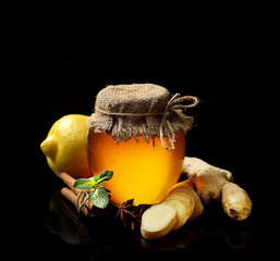Honey, ginger, lemon and spices on a white background