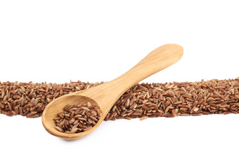 Line pile of brown rice grains isolated