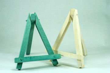 Blue and white wooden mini easels.