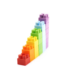 Growing stacks of toy bricks isolated