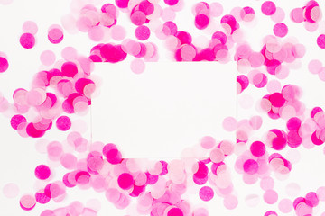 Pink paper confetti and empty card
