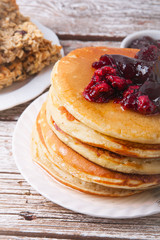 Stack of pancakes with glass of orange juice