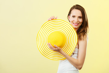 Woman in big yellow summer hat.