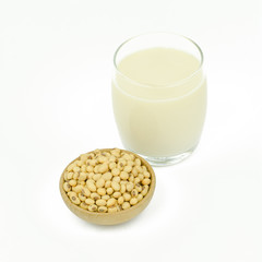 Milk with soy beans on white background.