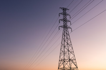 high voltage post.High-voltage tower sunset background.