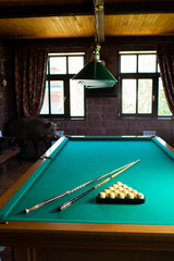 pool table with balls and cue