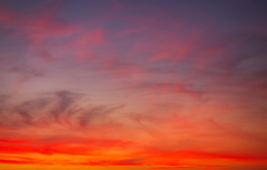 Fiery orange colorful sunset sky.