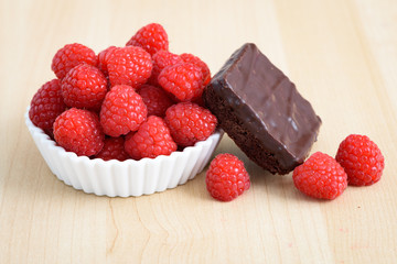 Ripe sweet raspberries and chocolate browny