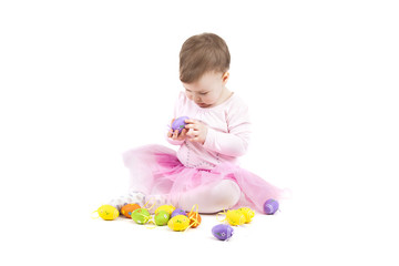 Portrait of a cute baby with Easter eggs