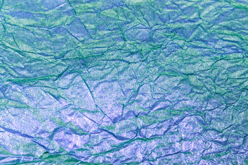 texture of crumpled colored paper with gold plating, crumpled pa