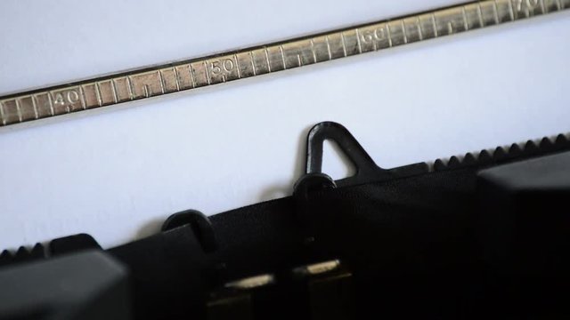 Typing the expression First and Foremost with an old manual typewriter