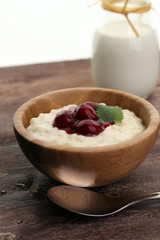 Milk rice pudding with hot cherries