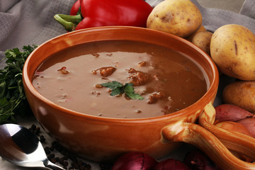 Tasty Hungarian beef goulash soup bograch close-up on the table
