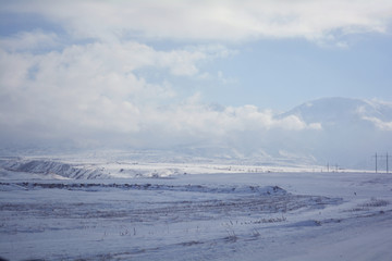 snow haze on the horizon of the mountains