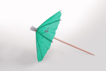 Green Cocktail Umbrella Isolated on White Background