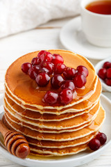 Pancake with honey and fresh berries. Cranberry, cowberry. Gourm