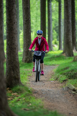 Middle-aged woman riding bicycle