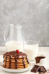 Pancake with chocolate on a white plate. Delicious Breakfast
