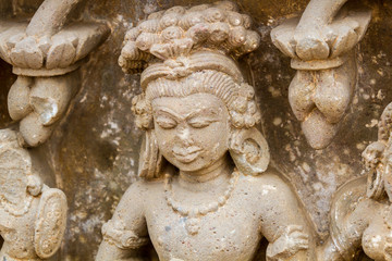 Fototapeta na wymiar A carving of an Apsara