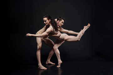 Proficient dancers performing together in the studio