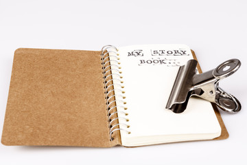 open empty diary or story book with pencil