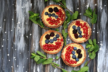 Tartlettes with fresh berries and cheese vanilla cream
