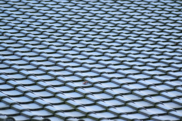 Abstract background tiles on traditional Japanese house roof in horizontal frame
