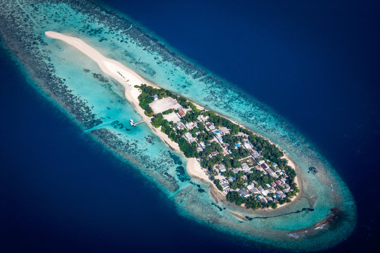 An Island In An Atoll Chain Seen From The Air In The Maldives