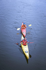 Traveling by kayak on the river on a sunny day.